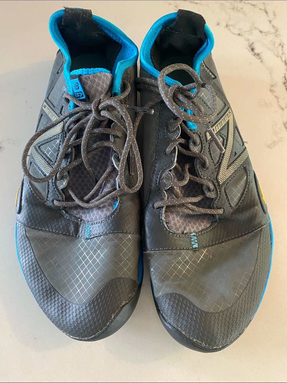 New Balance Minumus Shoes with Blue Accents
